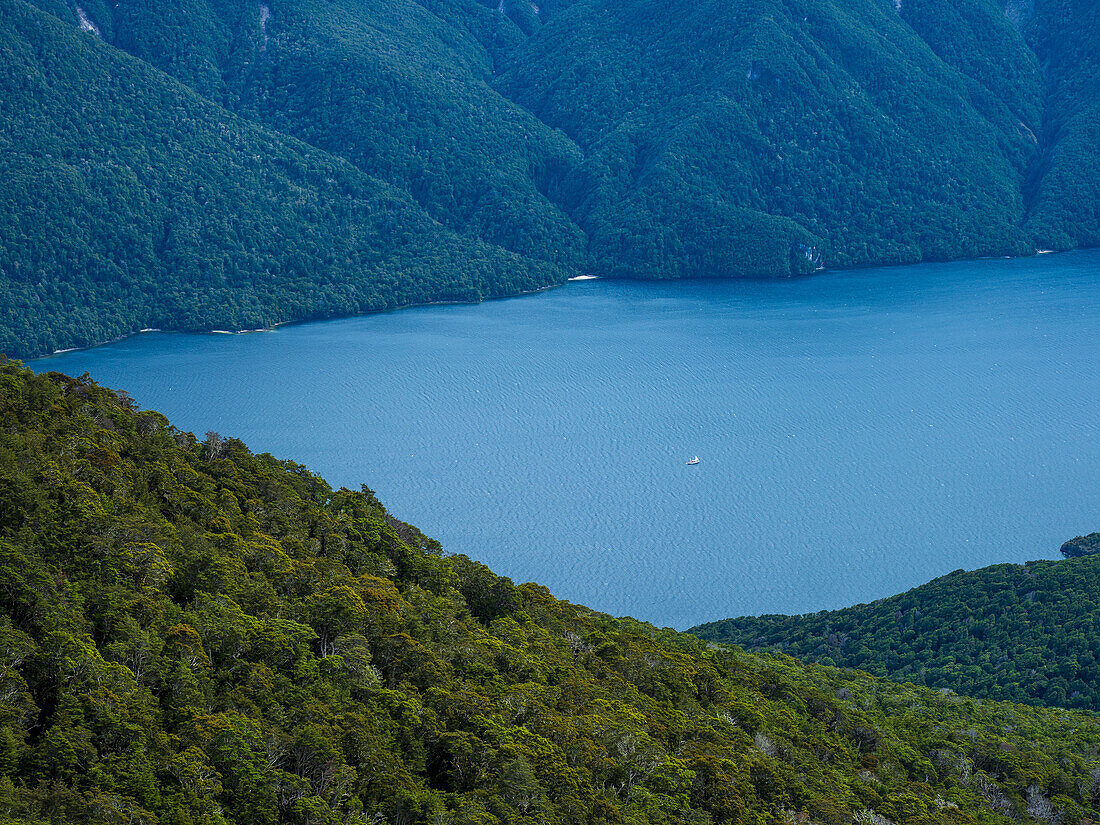 Blue lake surrounded with green hills