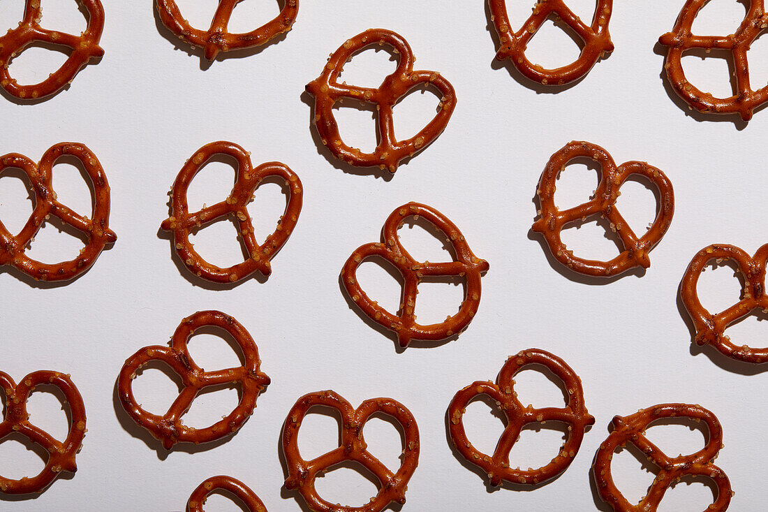 Overhead view of pretzels on white background