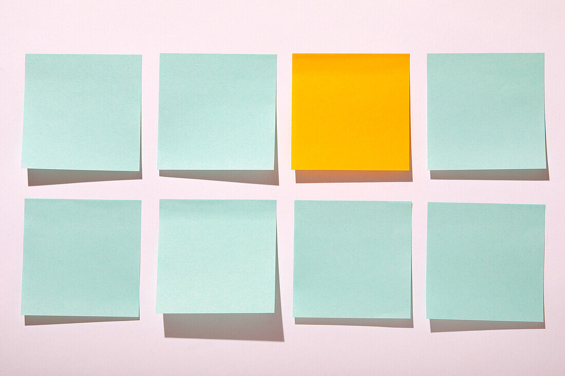 Rows of blank adhesive notes on white background