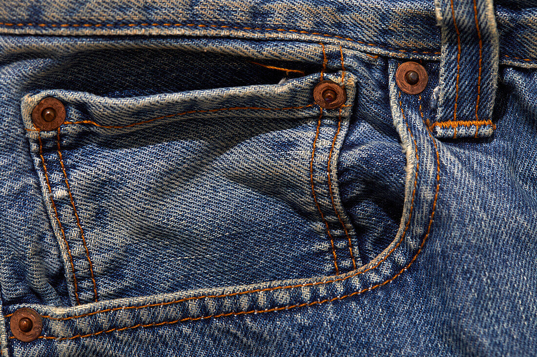 Close-up of pocket on worn jeans