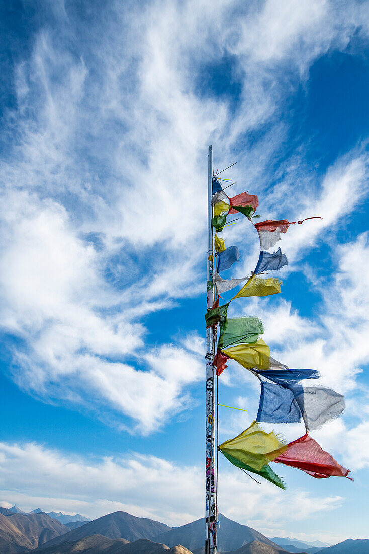 Prayer flags fluttering in wind atop Carbonate Mountain