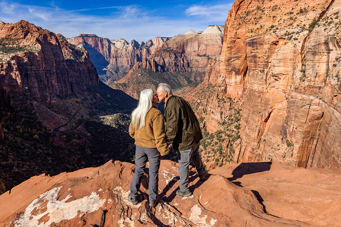 Rear view of senior couple kissing at Zion Overlook