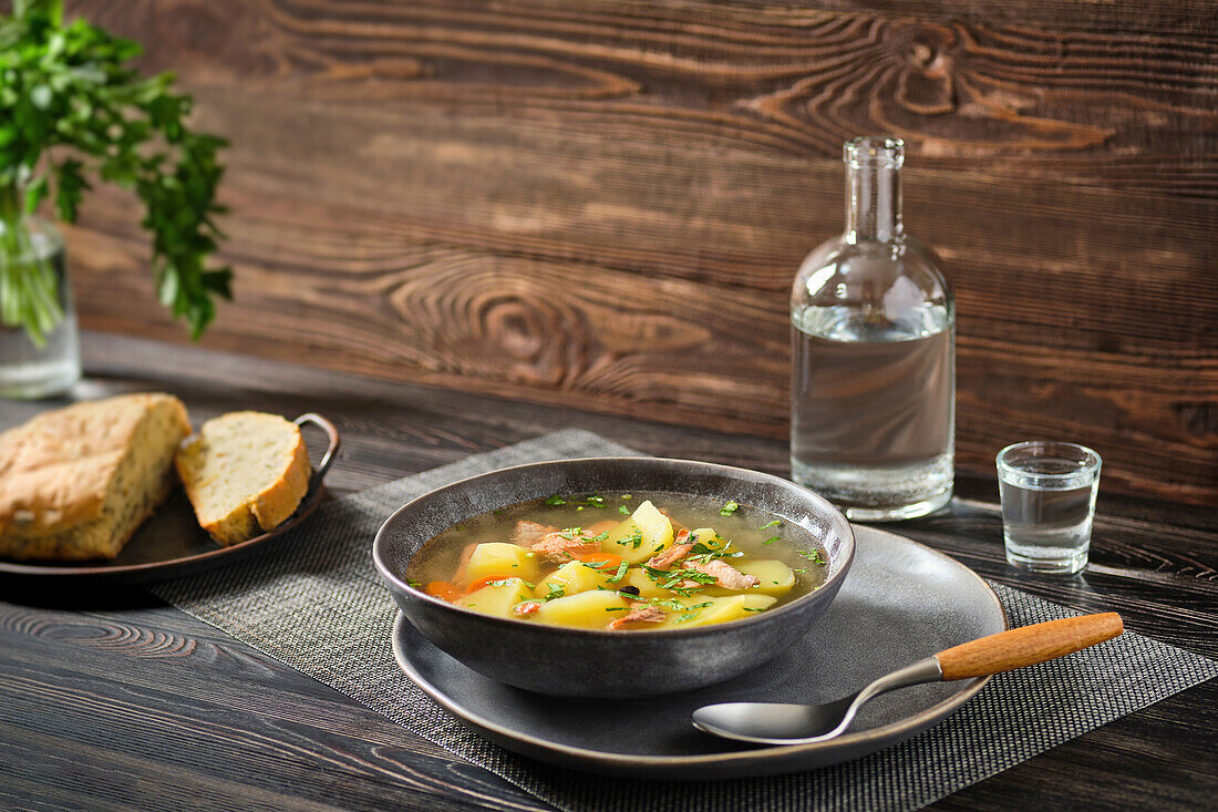 Salmon soup with potatoes and carrots