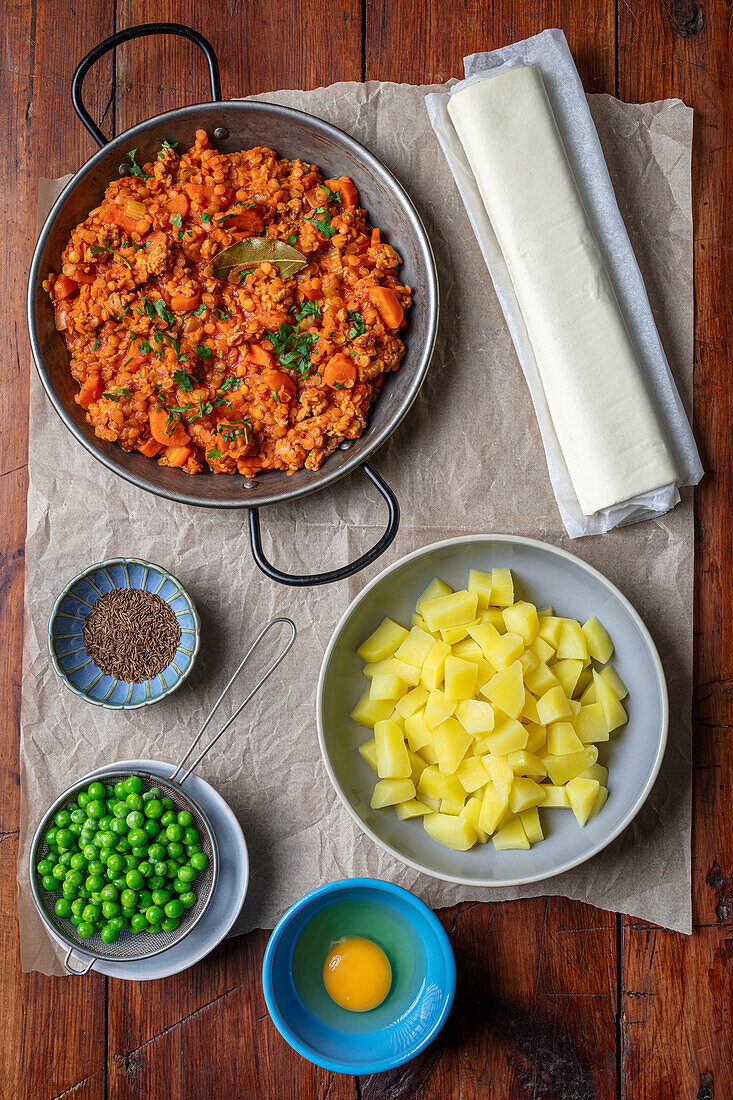 Ingredients for chicken and lentil ragout with potatoes in puff pastry