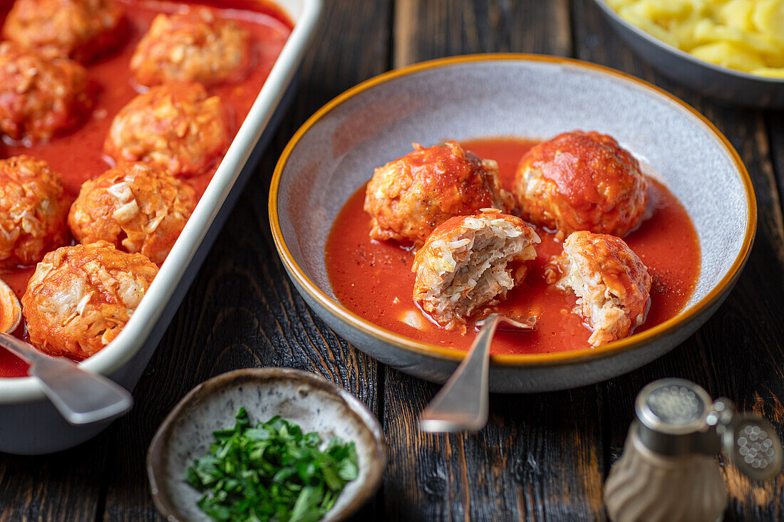 Chicken, rice and cabbage balls in tomato sauce