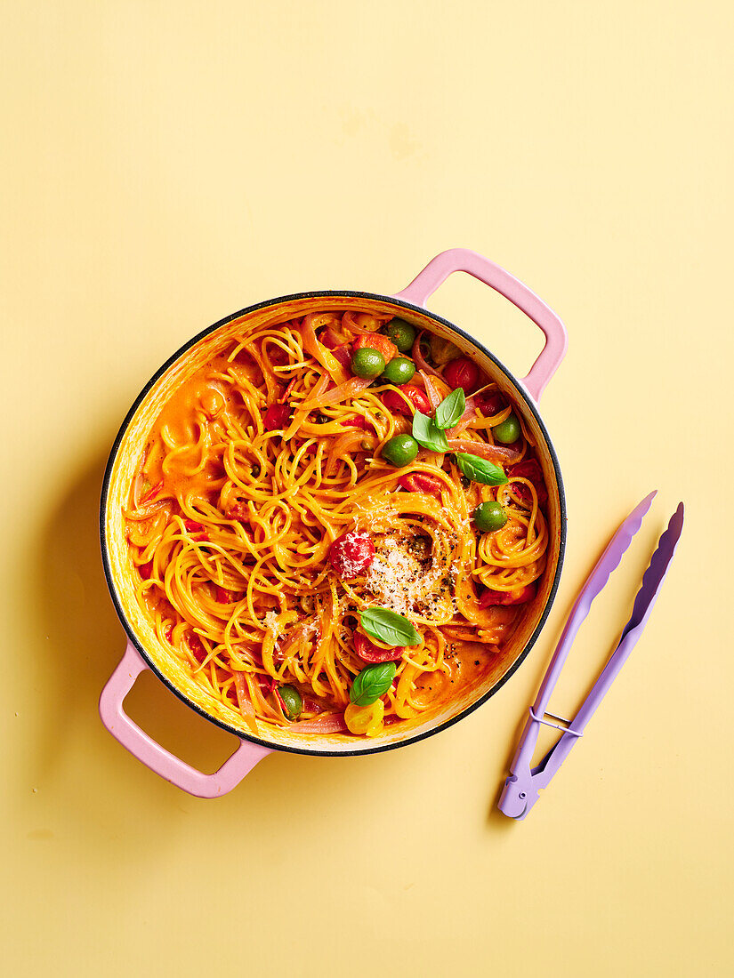 Spaghetti in mozzarella and tomato sauce with olives