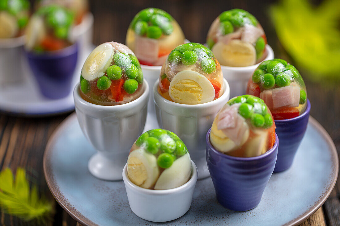 Aspic eggs with ham, quail eggs and vegetables