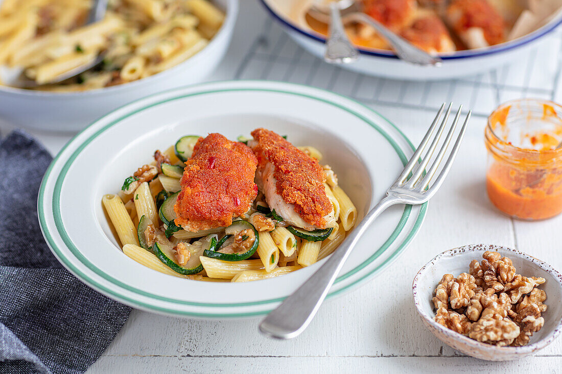 Chicken with red pesto crust on penne