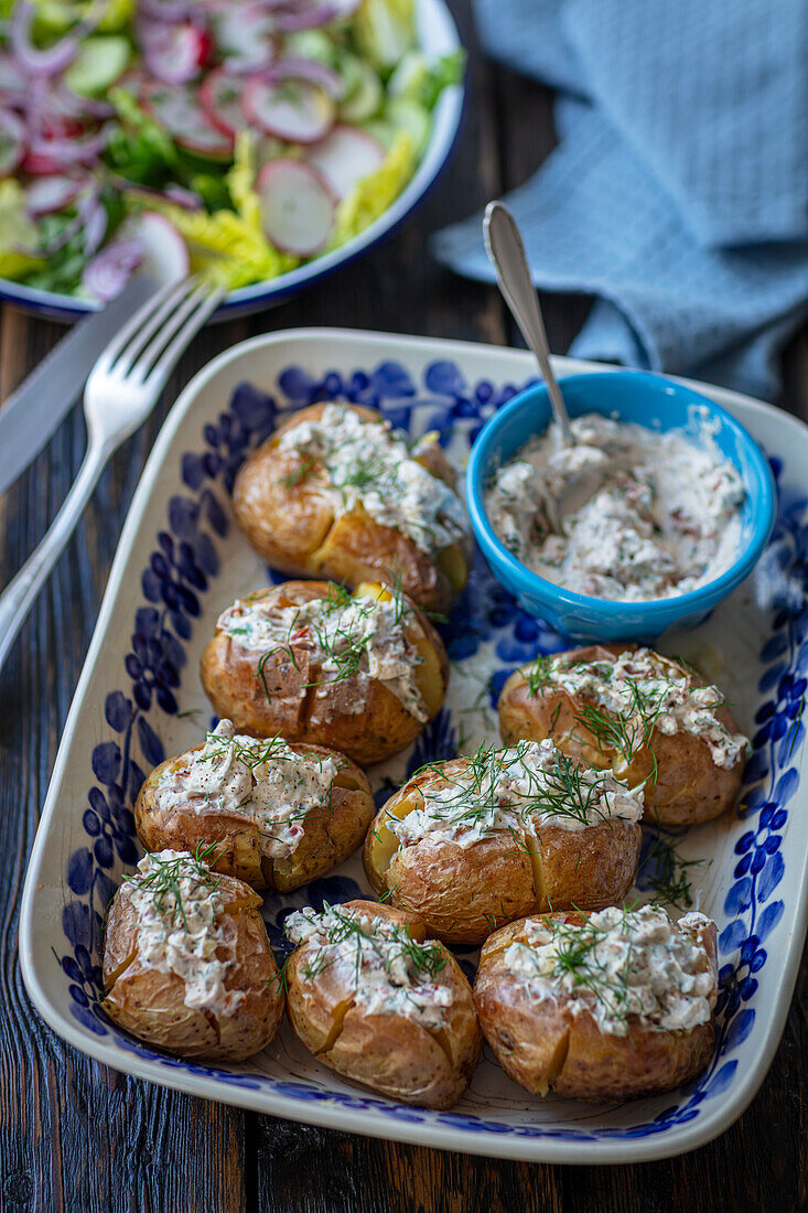 Baked potatoes with cream cheese, herbs and sun-dried tomatoes