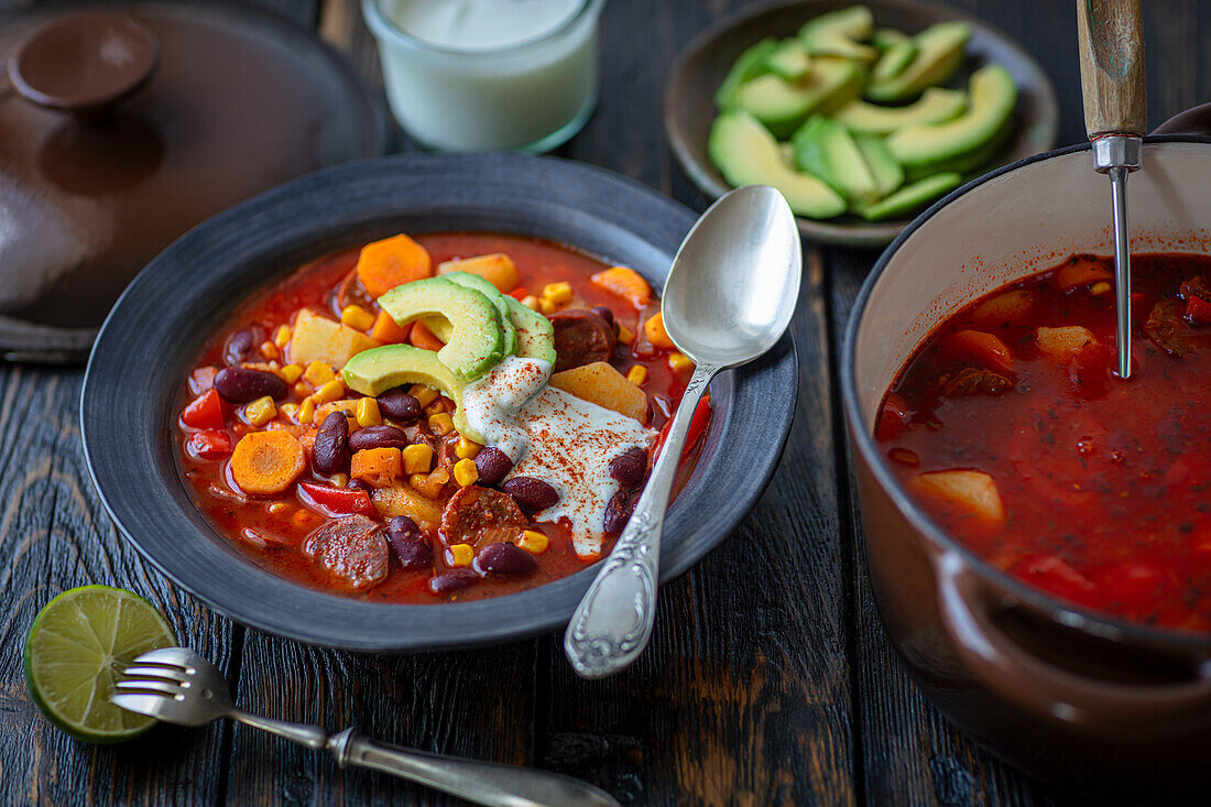 Mexican soup with chorizo, beans, sweetcorn and avocado