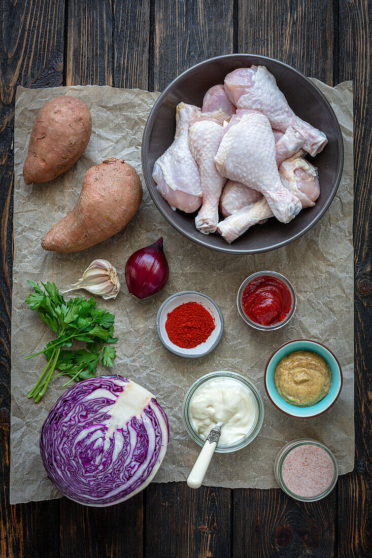 Ingredients for chicken drumsticks with sweet potatoes and red cabbage