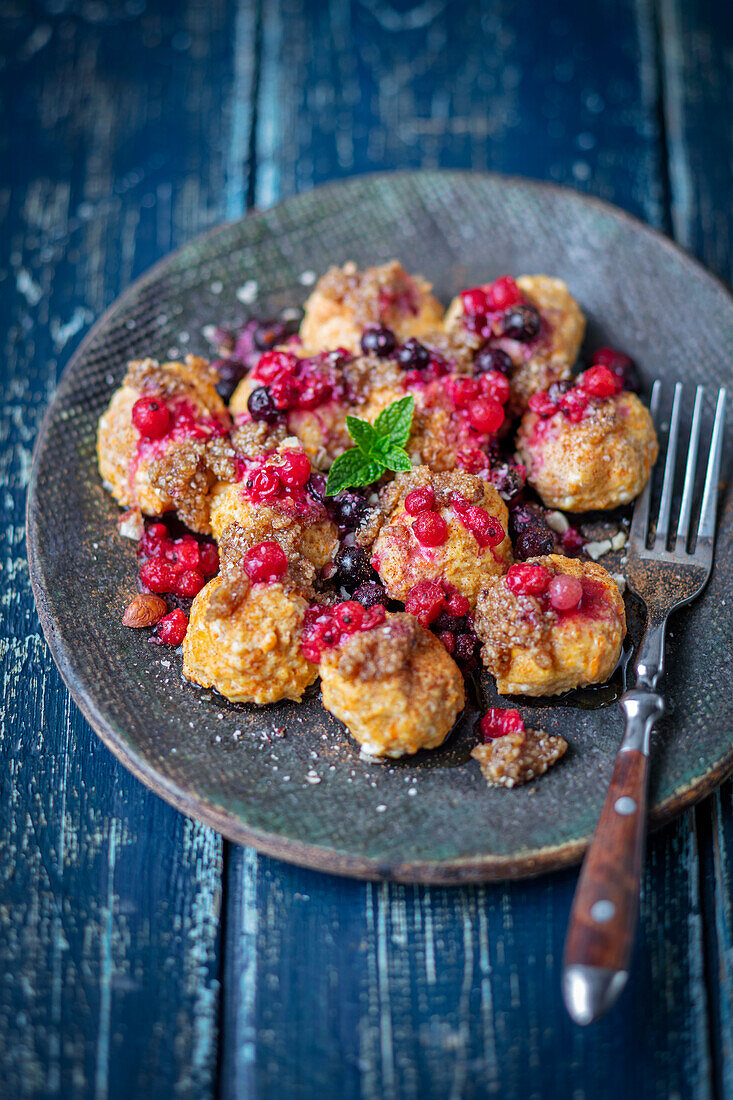 Quark and carrot dumplings with berries