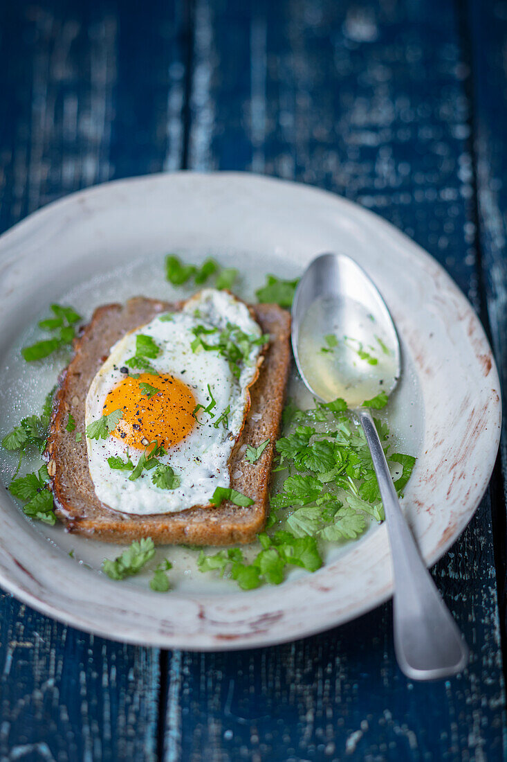 Sopa alentejana, chicken broth with toasted bread and fried egg