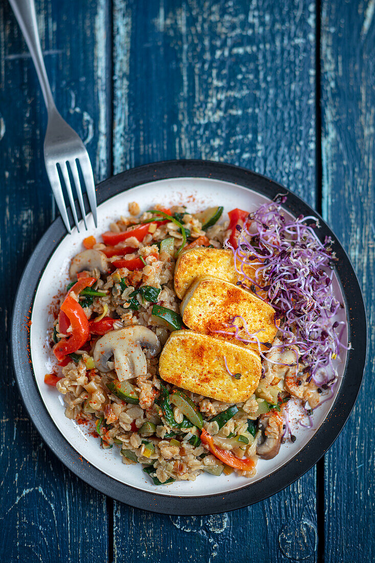 Savoury oatmeal with vegetables and tofu