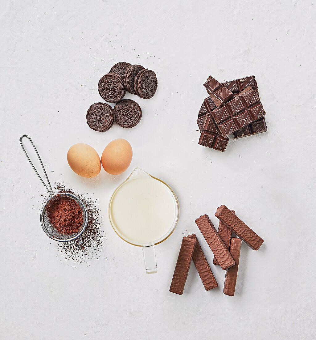 Ingredients for chocolate mousse with Oreo, cream and chocolate bar