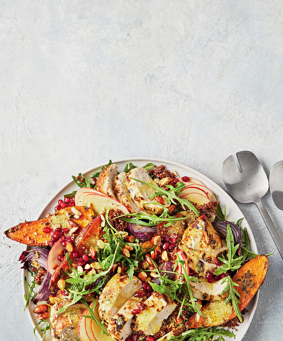 Autumn chicken salad with pomegranate, radishes and sweet potatoes