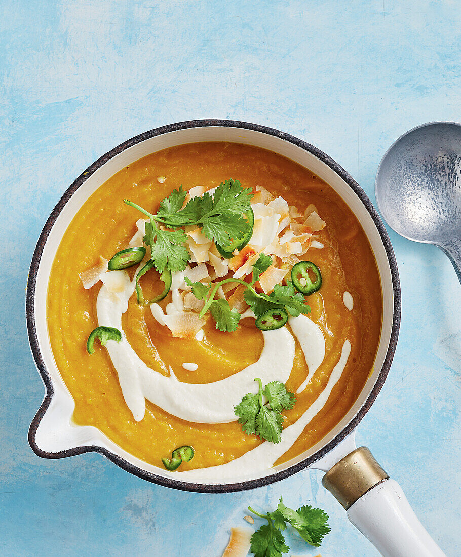 Lentil sweet potato soup with chilli, coriander and coconut flakes