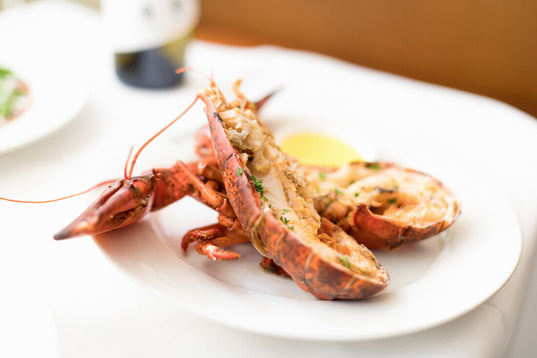 Halved lobster with lemon butter