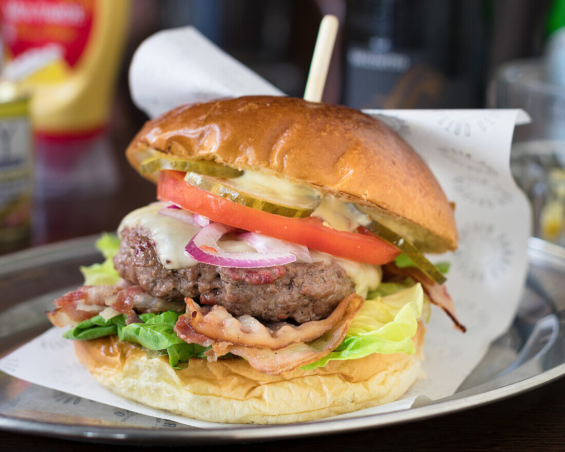 Bistro burger with cheese, bacon and salad