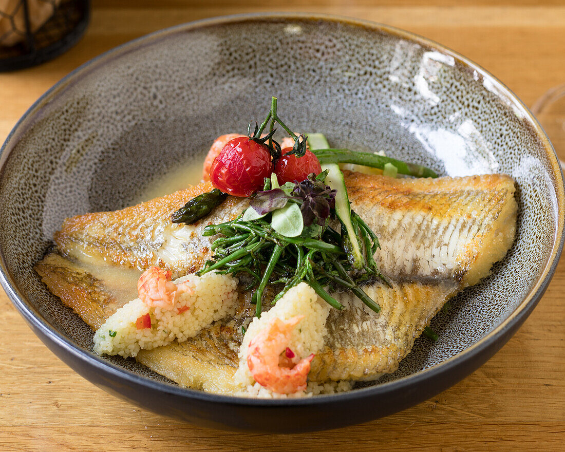 Plaice fillet with prawns, couscous and samphire