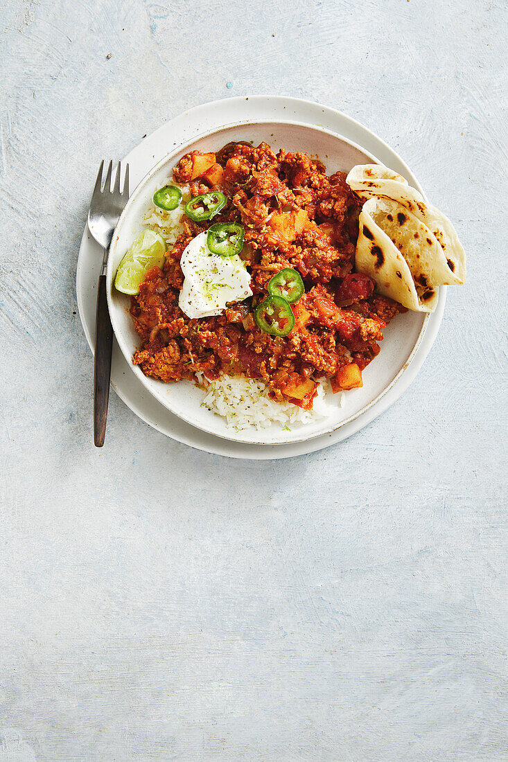 Mexican picadillo with rice and tortilla