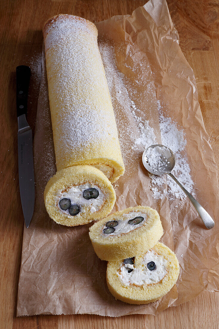 Sponge roll with blueberry and cream filling