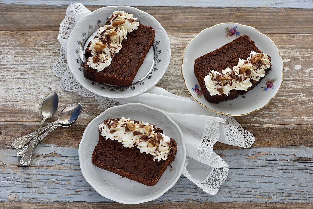 Vegan sweet potato brownie cake with whipped cream and walnuts