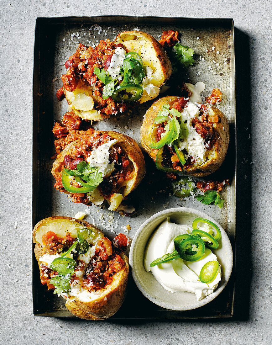 Baked potatoes with kidney beans, chilli and sour cream