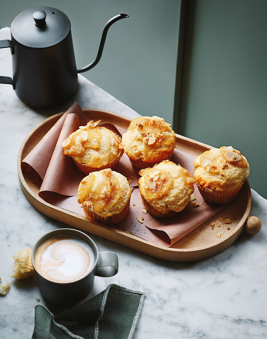 Poached pear muffins with maple syrup and almond crumble