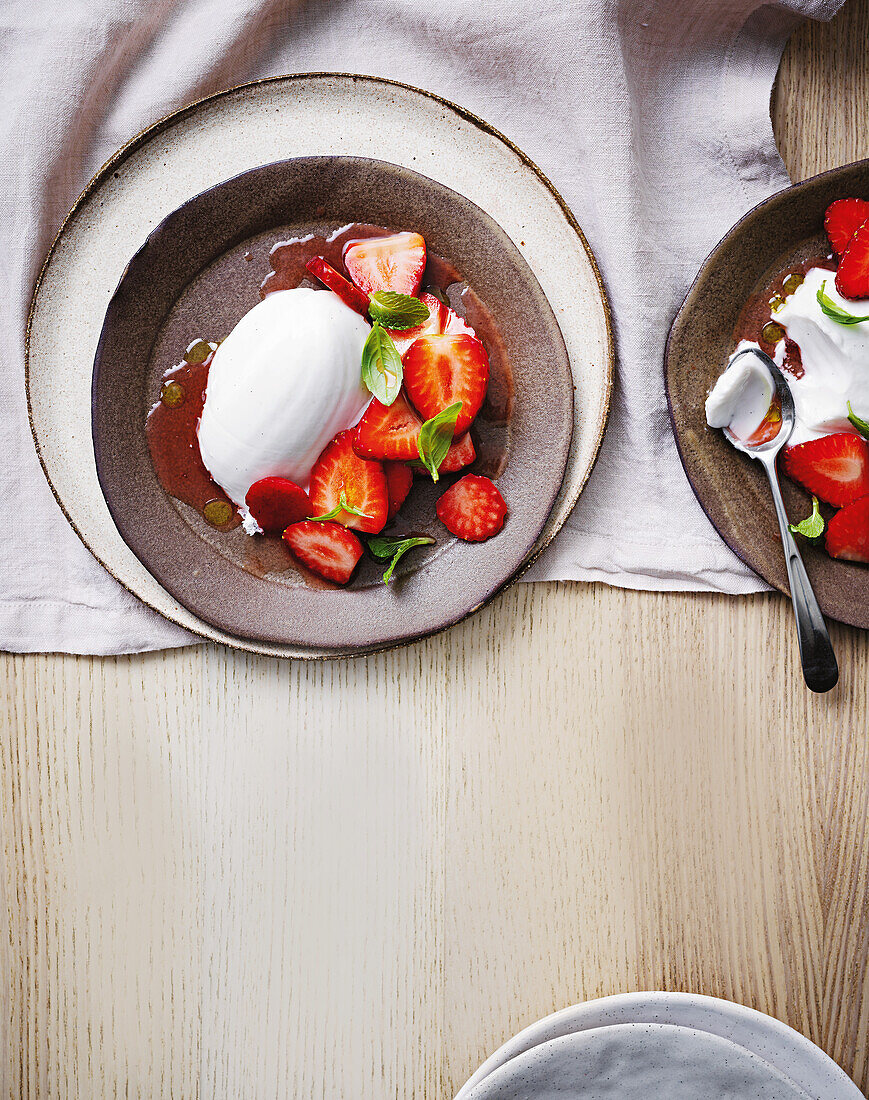 Coconut cream with strawberries and star anise