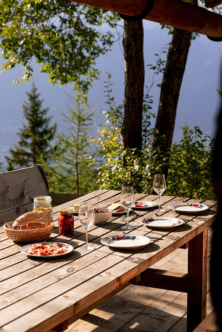 Table setting with Italian appetisers on a terrace