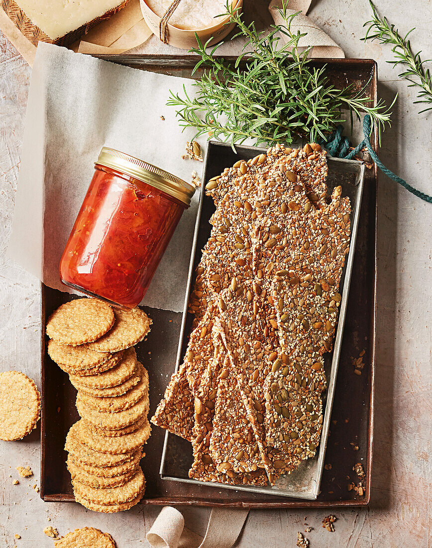 Peach chutney, crackers with seeds and oat biscuits