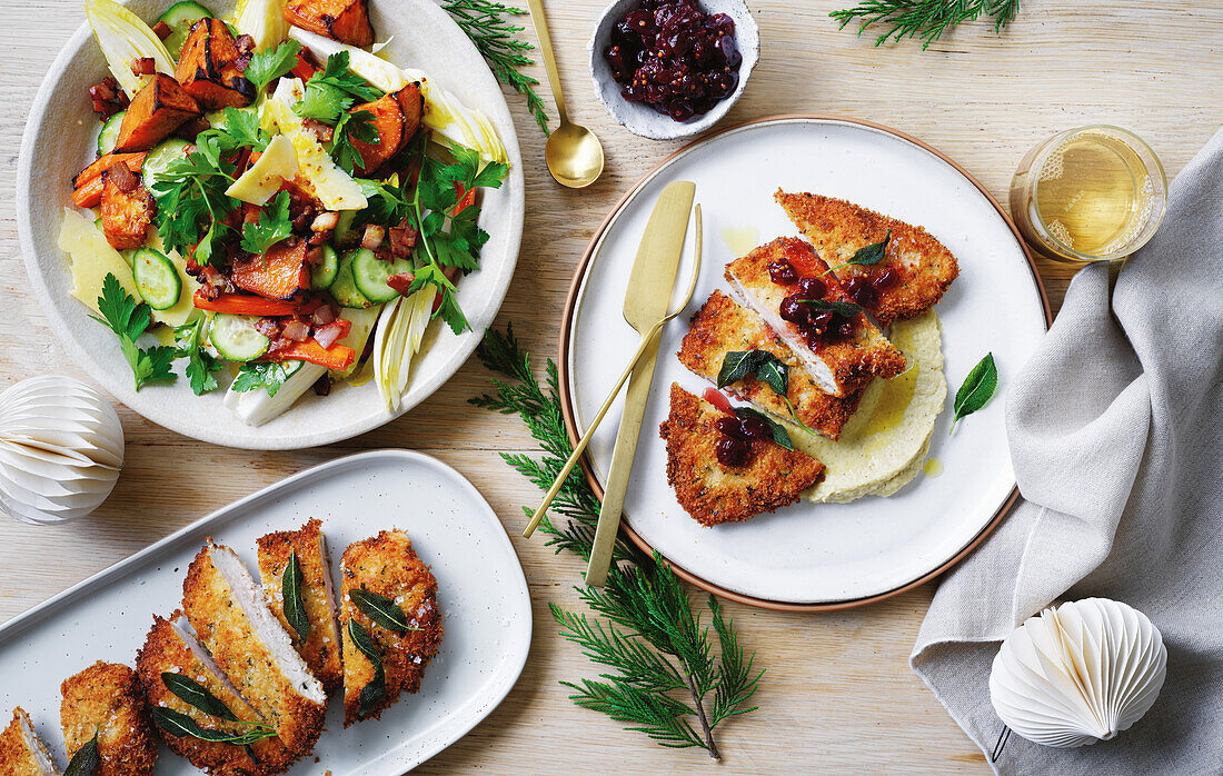 Breaded turkey escalope with cranberry sauce and salad