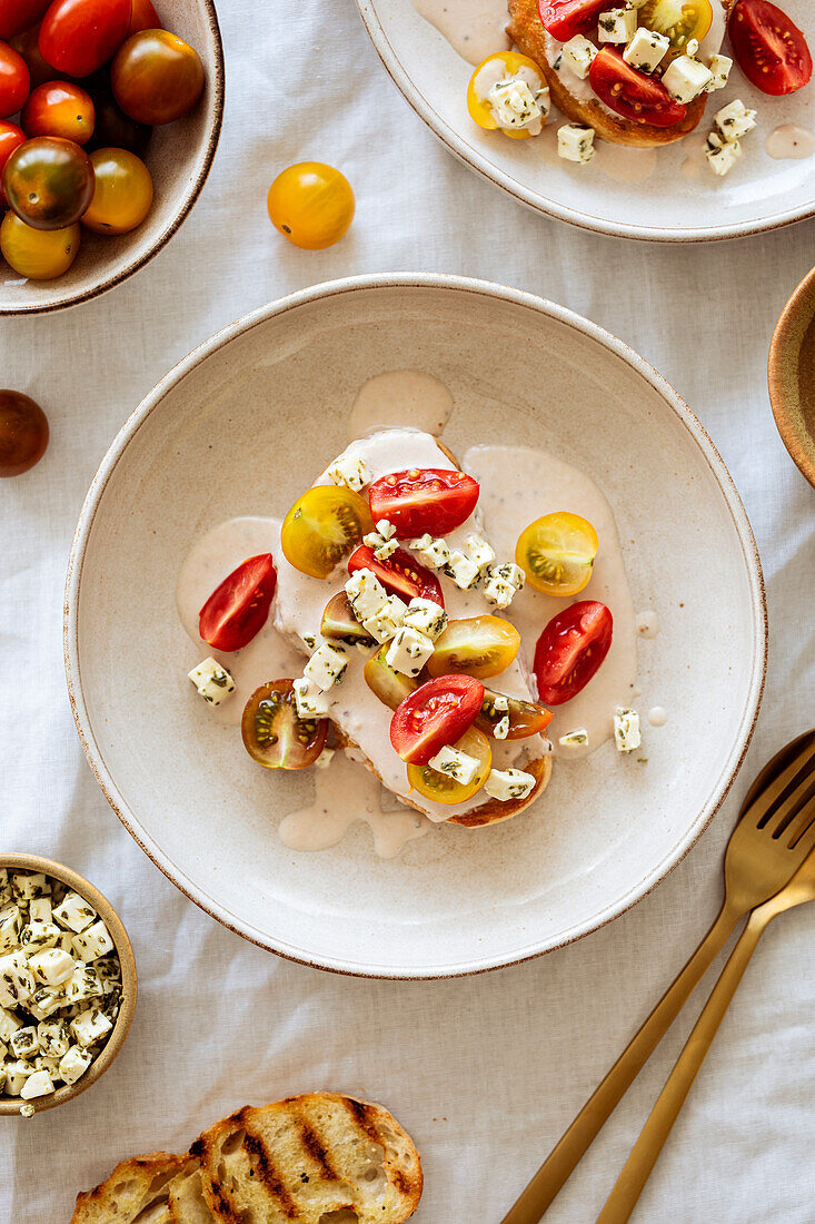 Burrata with cherry tomatoes and herb feta