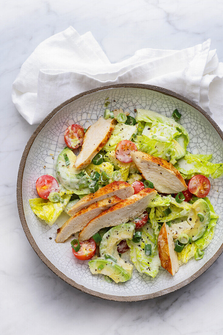 Caesar salad with chicken breast