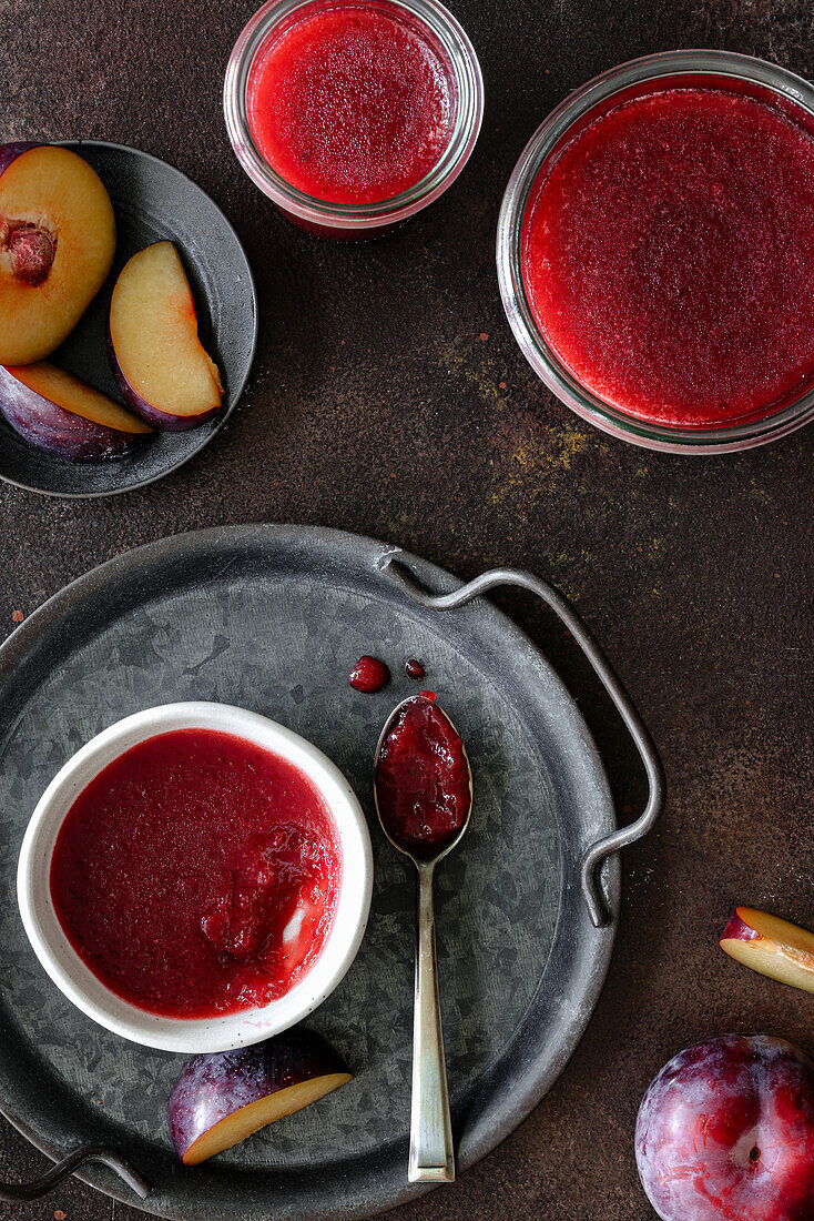 Plum jam in bowls and jars