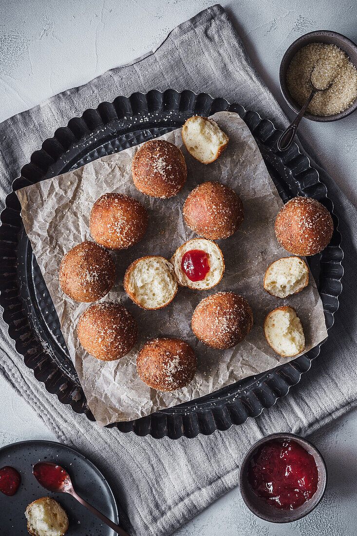 Freshly baked quark balls with jam filling