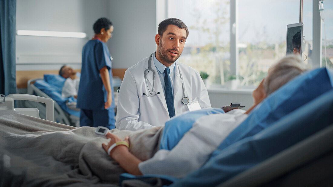 Doctor giving bedside consultation