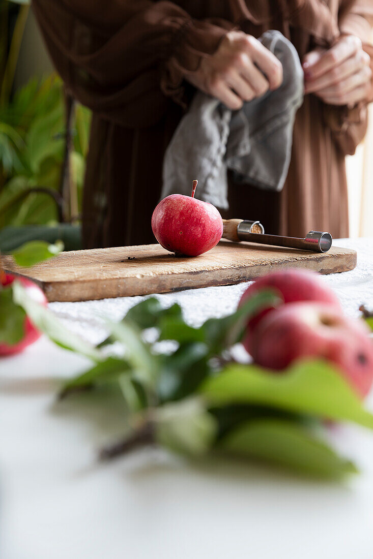 Red apples on a wooden board