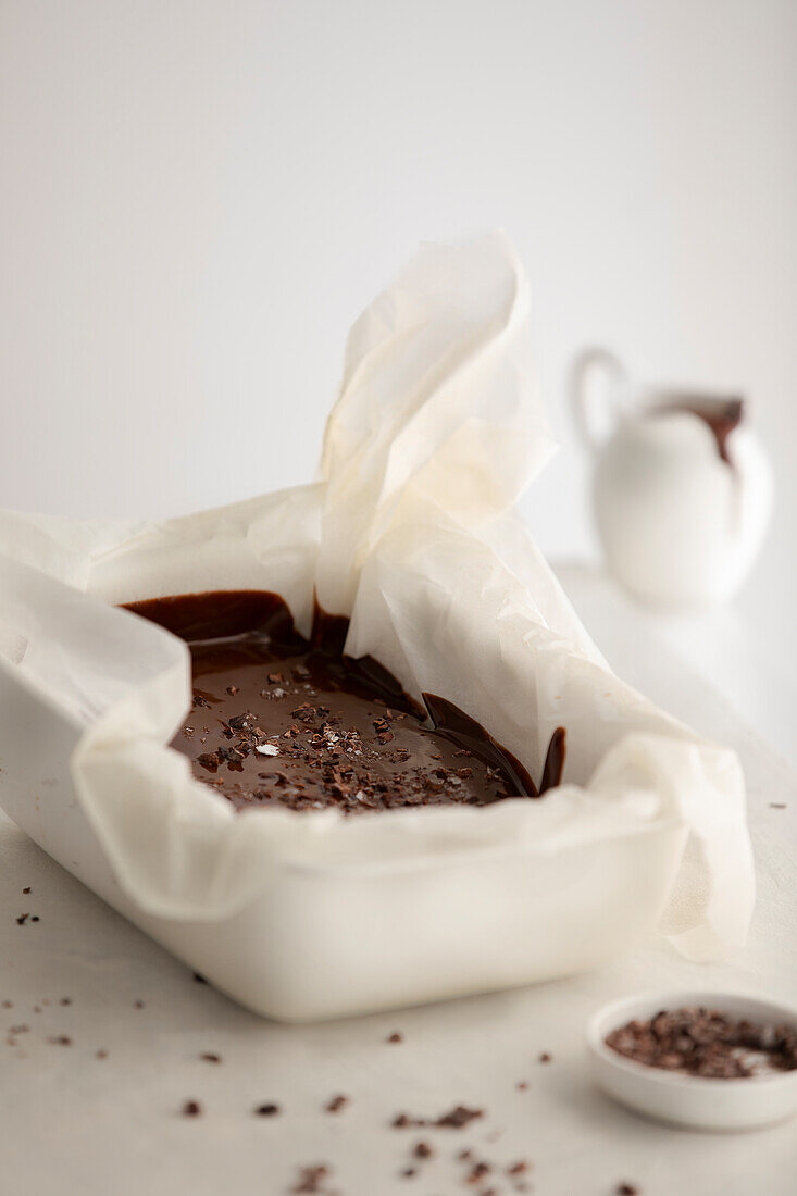 Pour chocolate ganache into baking tin