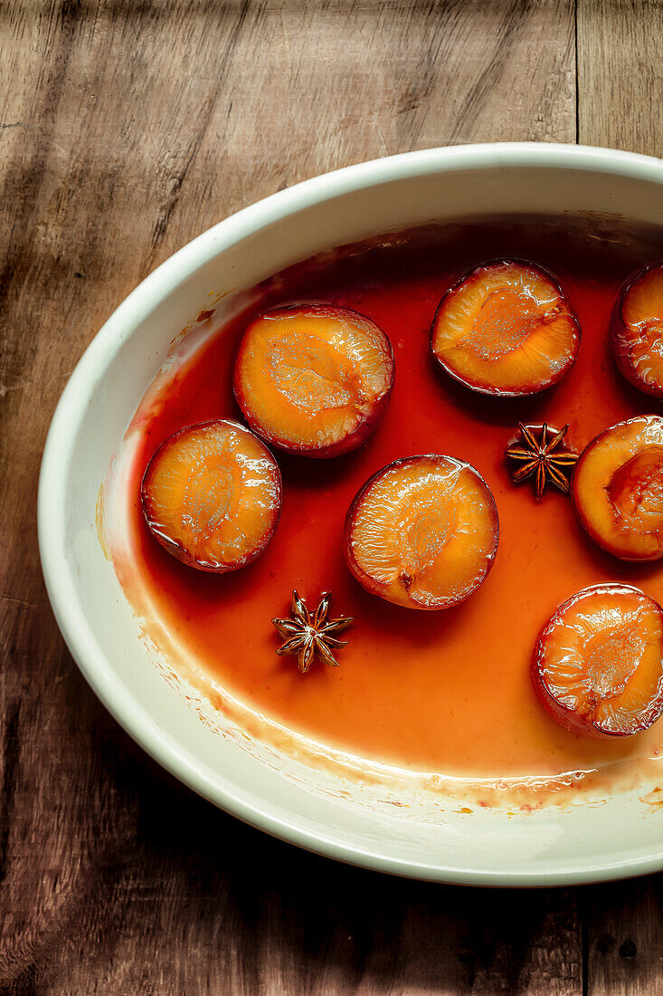 Plum halves in syrup with star anise