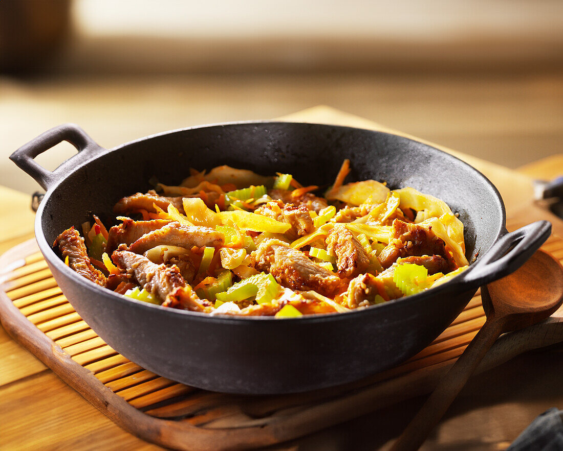 Wok vegetables with turkey and celery stalks