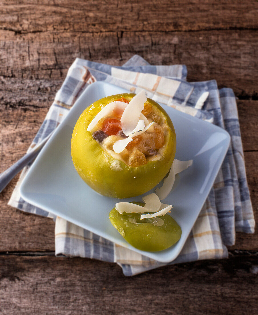 Stuffed apple with coconut milk and dried fruit