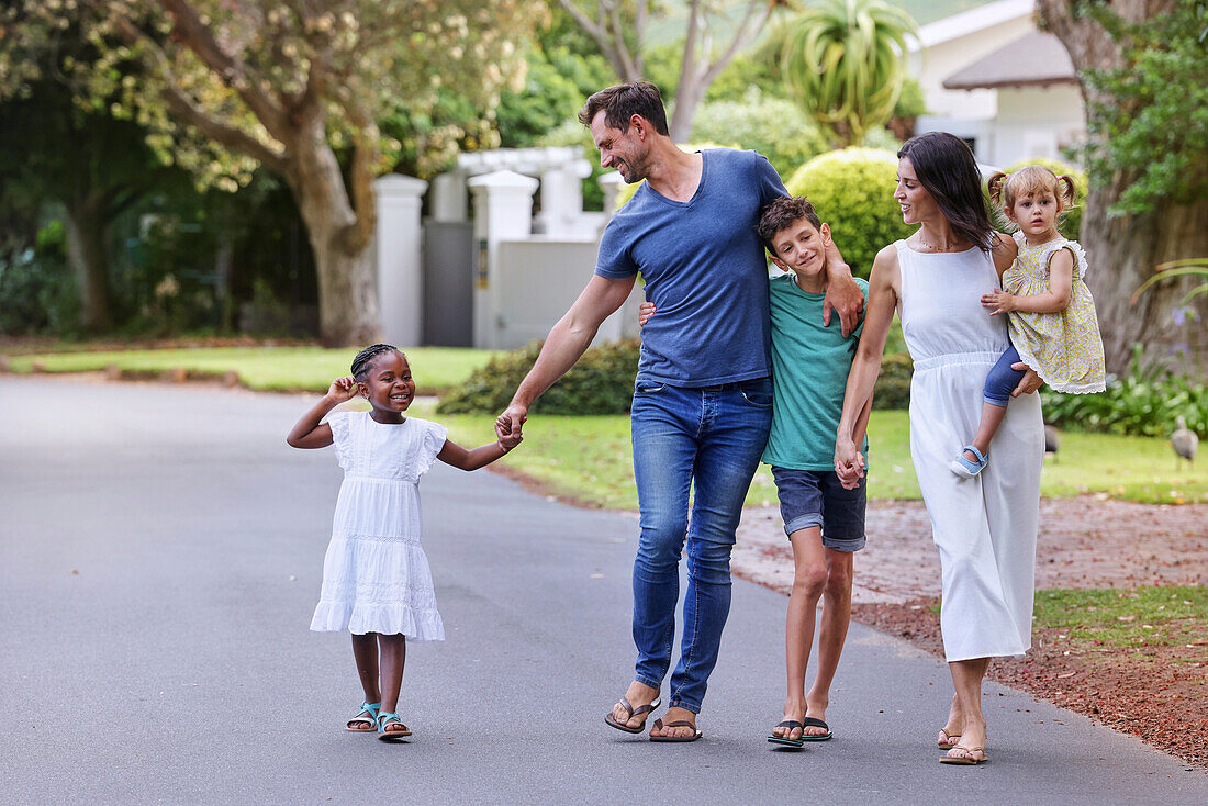 Parents with children walking on street