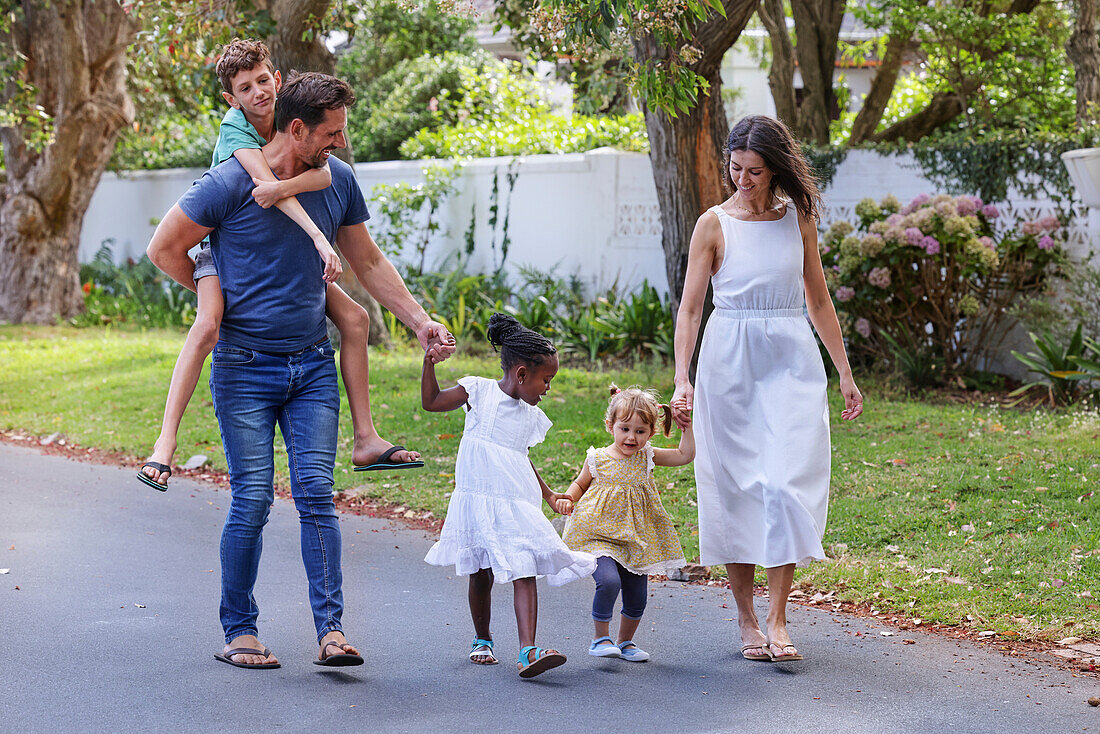 Parents with children walking on street