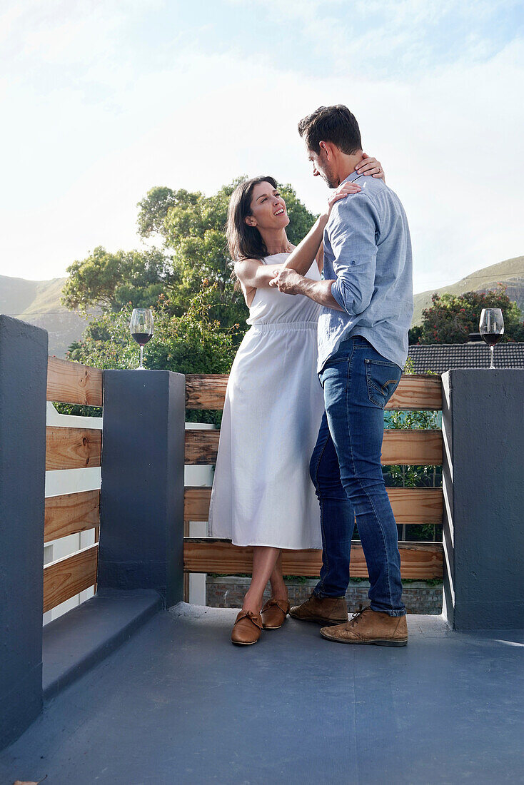 Couple embracing on terrace