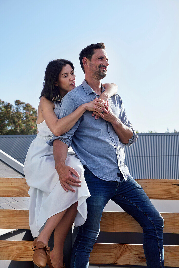 Couple embracing on terrace