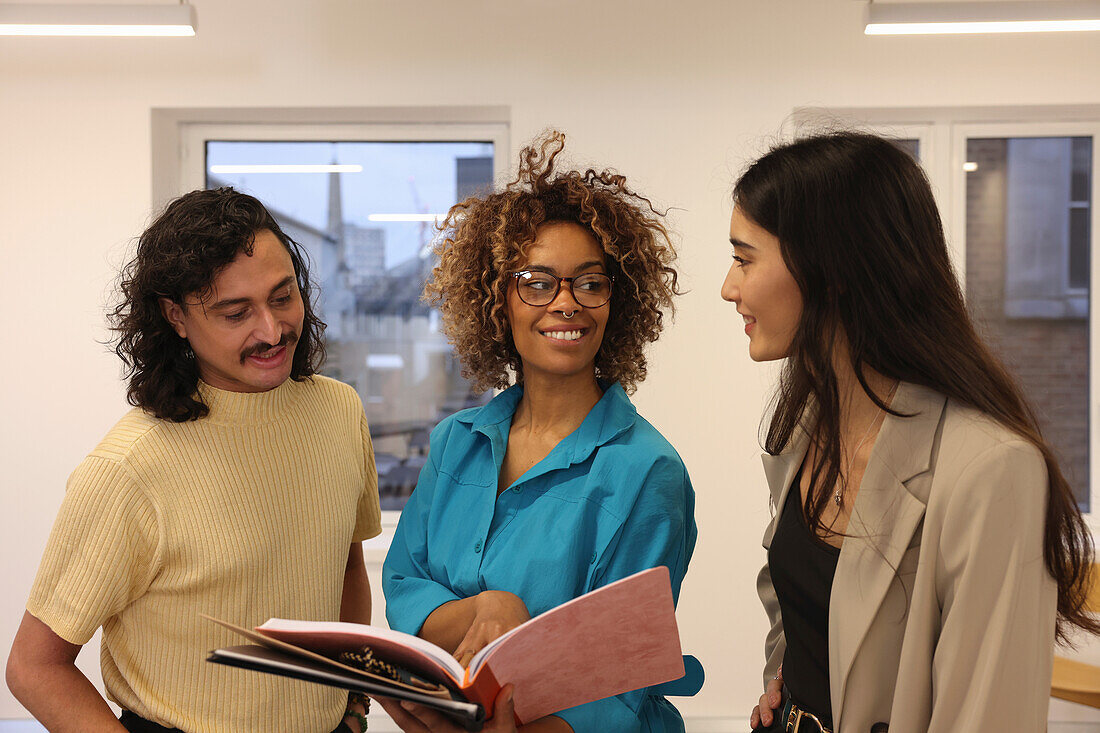 Creative team talking in modern studio