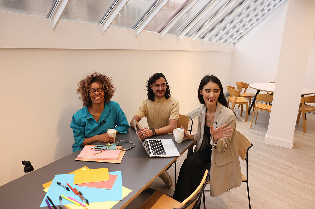 Creative team talking during meeting in modern office