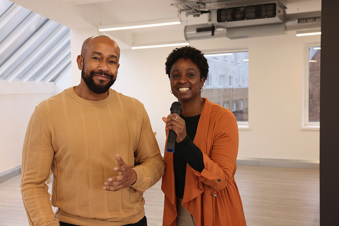 Portrait of smiling creative team having presentation in studio